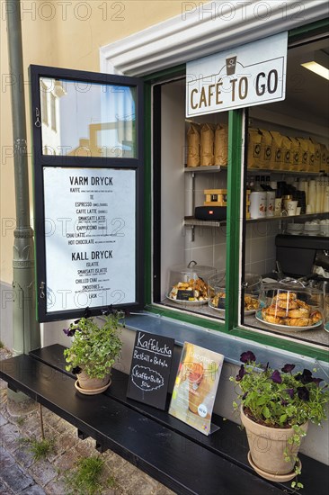 Decorated open window of a cafe with menu