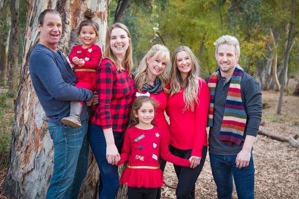 Multigenerational mixed-race family portrait outdoors