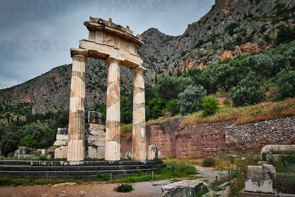 Tholos with Doric columns at the sanctuary of Athena Pronoia temple ruins in ancient Delphi