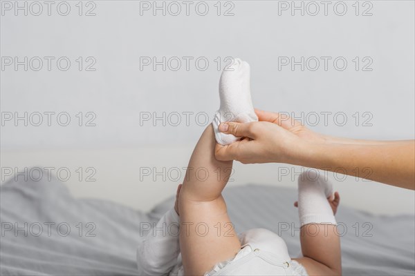 Baby putting socks