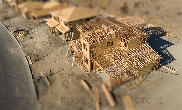 Aerial view of new homes construction site with tilt-shift blur