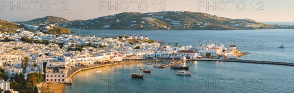 View of Mykonos town Greek tourist holiday vacation destination with famous windmills