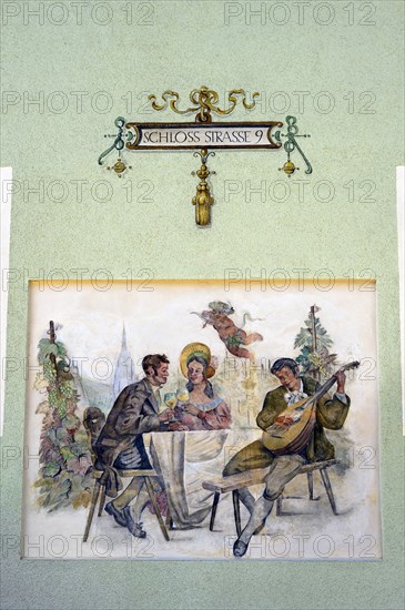 Mural with drinking scene and Cupid