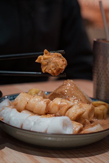 Sticks of steamed dumplings and rice noodle rolls at a Cantonese restaurant in Macau