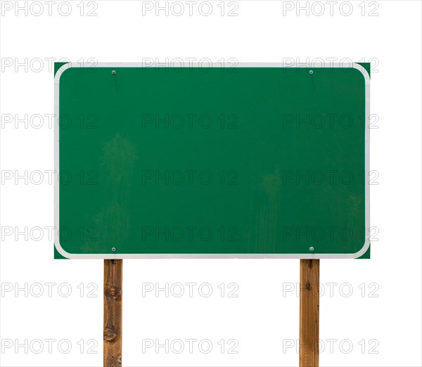 Blank green road sign with wooden posts isolated on a white background