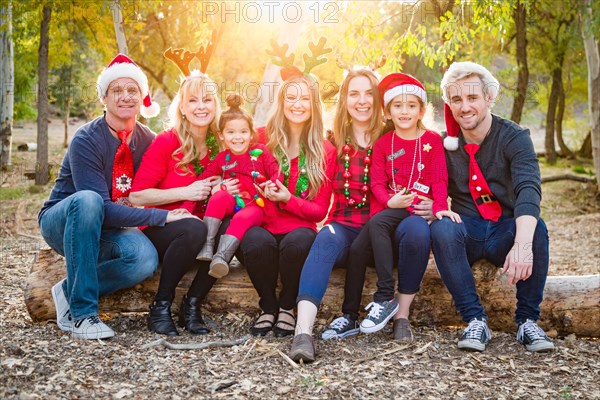 Christmas themed multiethnic family portrait outdoors