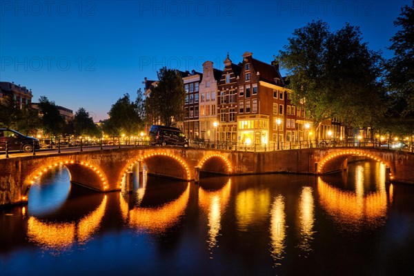 Night view of Amterdam cityscape with canal
