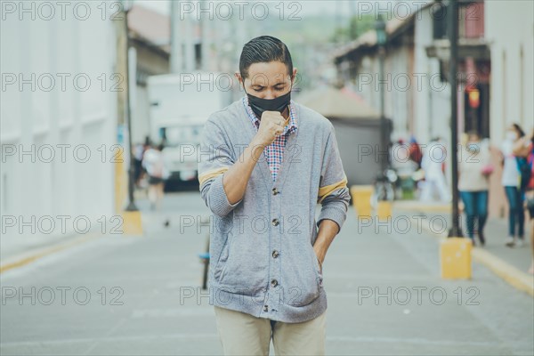 Coughing man with surgical mask