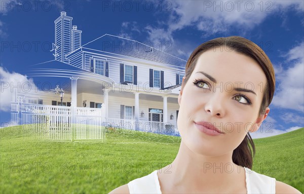 Curious mixed-race female looks over to ghosted house drawing