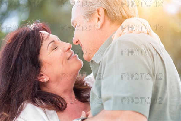 Happy middle aged couple enjoy A romantic slow dance outside