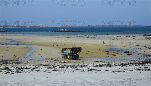 Beach Plage de Kloukouri with tractor loading seaweed