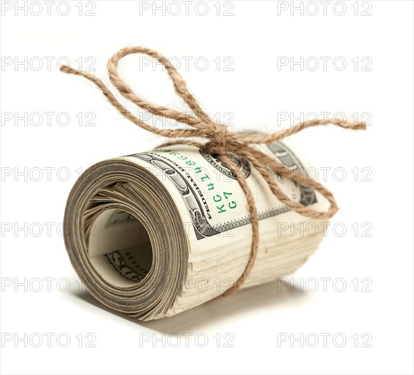 Roll of one hundred dollar bills tied in burlap string on white