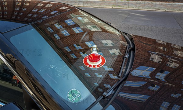 Civilian police vehicle with baton on the dashboard