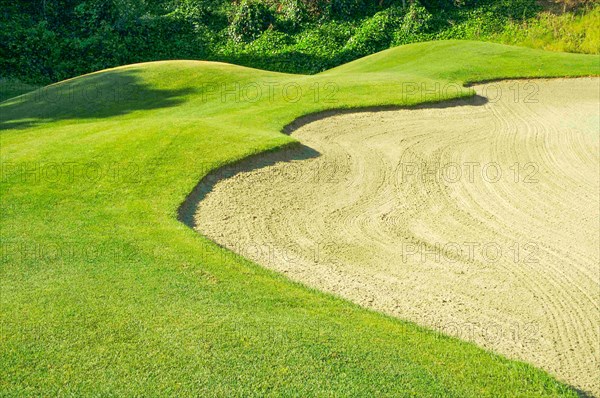 Abstract of golf course and sand bunker
