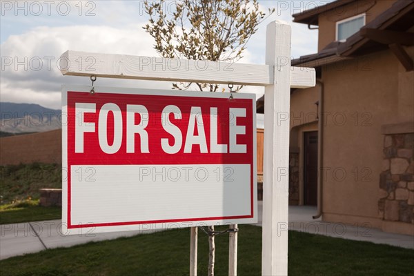 For sale real estate sign in front of house ready for your own copy