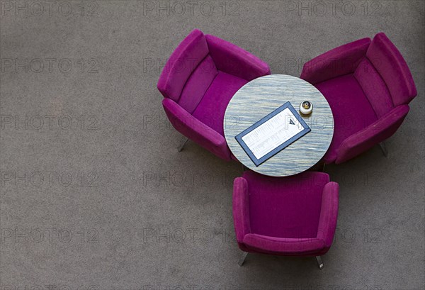 Arrangement of coloured club chairs in the restaurant