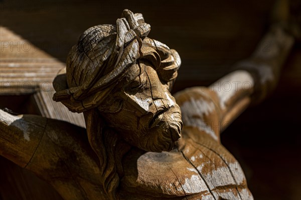 Face of a Christ figure on a wayside cross