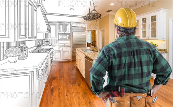 Male contractor with hard hat and tool belt looking at custom kitchen drawing photo combination on white