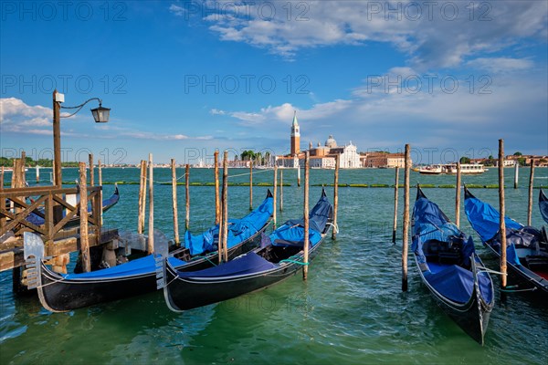 Gondolas and in lagoon of Venice by Saint Mark