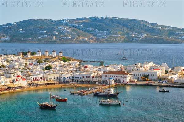 View of Mykonos town Greek tourist holiday vacation destination with famous windmills