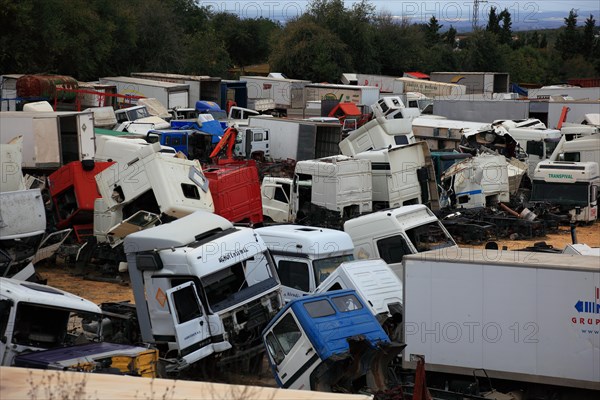 Car cemetery with truck