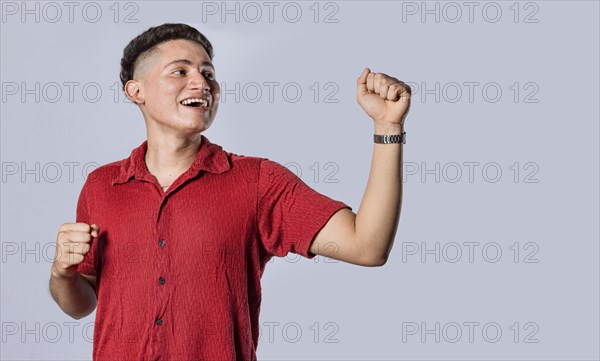 Guy raising hands in victory sign