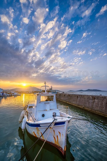 Old fishing boat in port of Naousa on sunset. Paros lsland