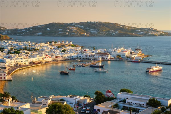 View of Mykonos town Greek tourist holiday vacation destination with famous windmills