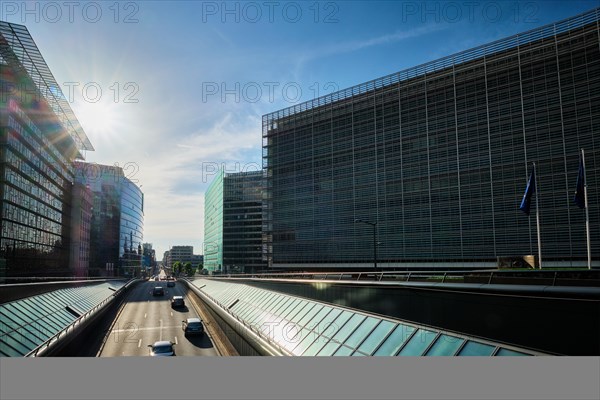 Street traffic in Brussels near European Commission building on sunset