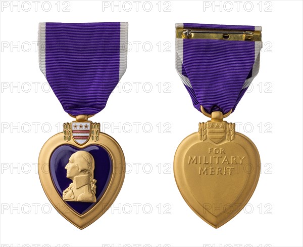 Front and back of purple heart military merit medal against white background