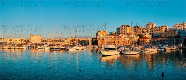 Venetian Fort castle in Heraklion and moored fishing boats