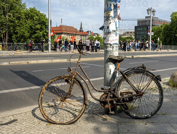 Old and rusty bicycle parked at the roadside