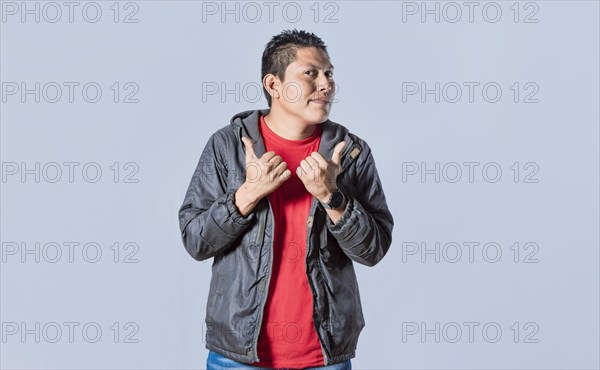 Handsome man pointing to the side