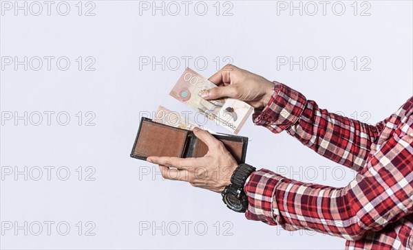 Man taking money out of his wallet