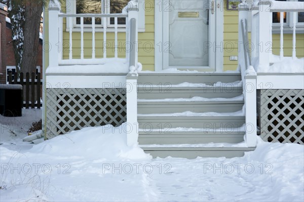 Home facade and steps on a blustery winter day