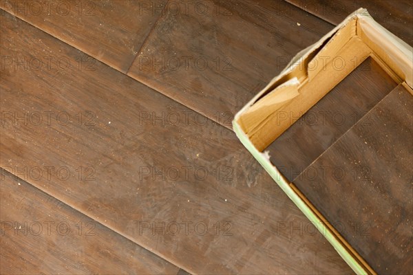 Newly installed brown laminate flooring abstract