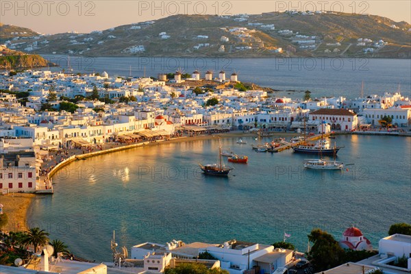 View of Mykonos town Greek tourist holiday vacation destination with famous windmills