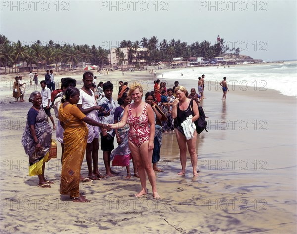 Tourists in kovalam beach