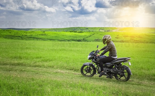 Biker man on a country road
