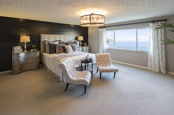 Beautiful abstract of inviting bedroom interior and sitting area