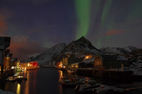 Small harbour with illuminated houses