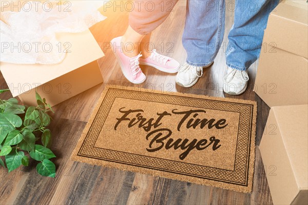 Man and woman unpacking near our first time buyer welcome mat
