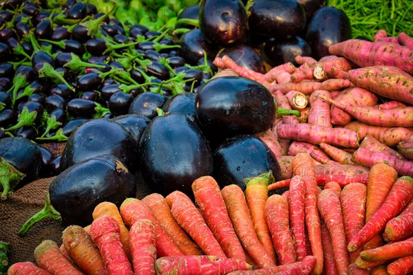 Vetegables carrots and aubergines in vegetable street market in India. Sardar Market