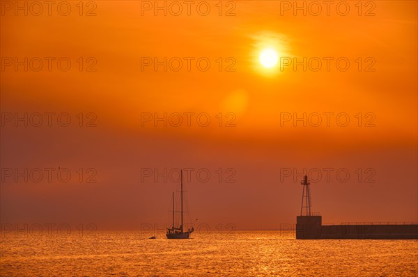 Ship schooner boat sihouette in port of Marseille on sunset