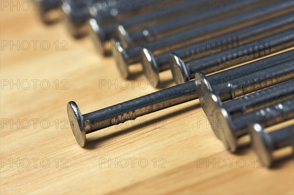 Macro of nails on a wood background