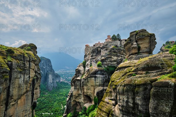 Monastery of Varlaam in famous greek tourist destination Meteora in Greece on sunset with scenic scenery landscape