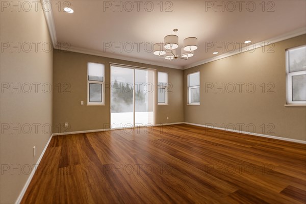 Newly remodeled room of house with finished wood floors