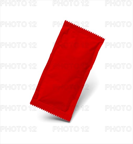 Blank red condiment packet floating isolated on white background