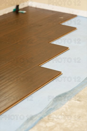 Newly installed brown laminate flooring abstract