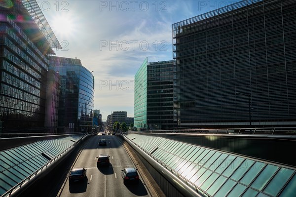 Street traffic in Brussels near European Commission building on sunset